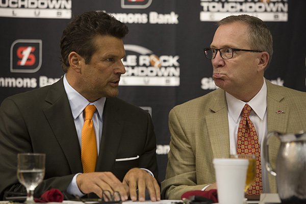 David Bazzell, left, speaks with Arkansas athletics director Jeff Long on Monday, Sept. 21, 2015, at Embassy Suites in Little Rock. 