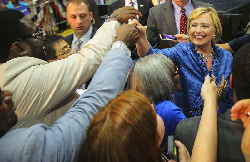 Democratic presidential candidate Hillary Rodham Clinton reaches out to supporters Monday, Sept. 21, 2015, after speaking on the campus of Philander Smith College in Little Rock.