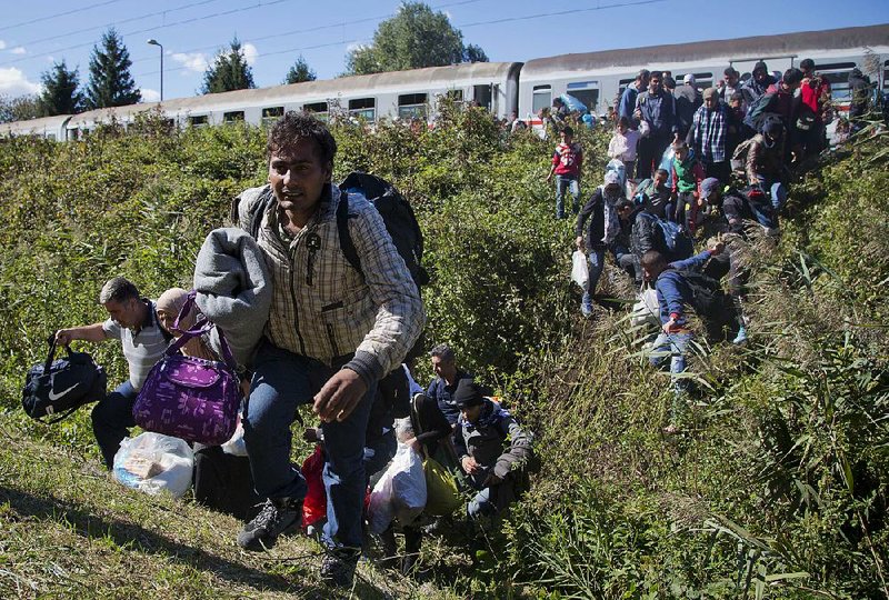 Migrants disembark a train that brought them Monday to the Hungarian border in Botovo, Croatia.
