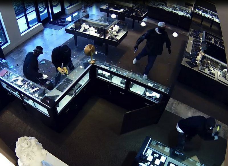 Surveillance video from the scene of an armed robbery Tuesday, Sept. 22, 2015, at Roberson's Fine Jewelry in Little Rock shows four of the five men connected to the crime.
