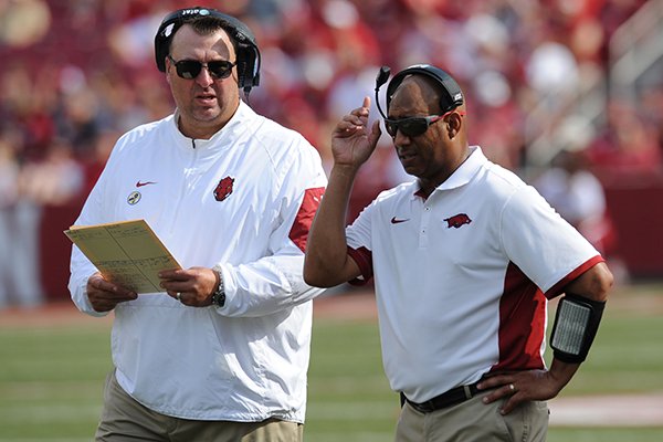 Arkansas coach Bret Bielema speaks with receivers coach Michael Smith against University of Texas at El Paso's Saturday, Sept. 5, 2015, during the third quarter of play in Razorback Stadium in Fayetteville. 