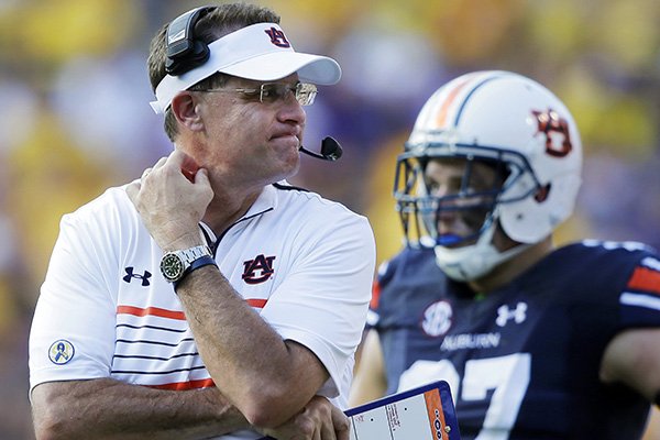 In this Saturday, Sept. 19, 2015, file photo, Auburn head coach Gus Malzahn reacts in the second half of an NCAA college football game against LSU in Baton Rouge, La. (AP Photo/Gerald Herbert, File)