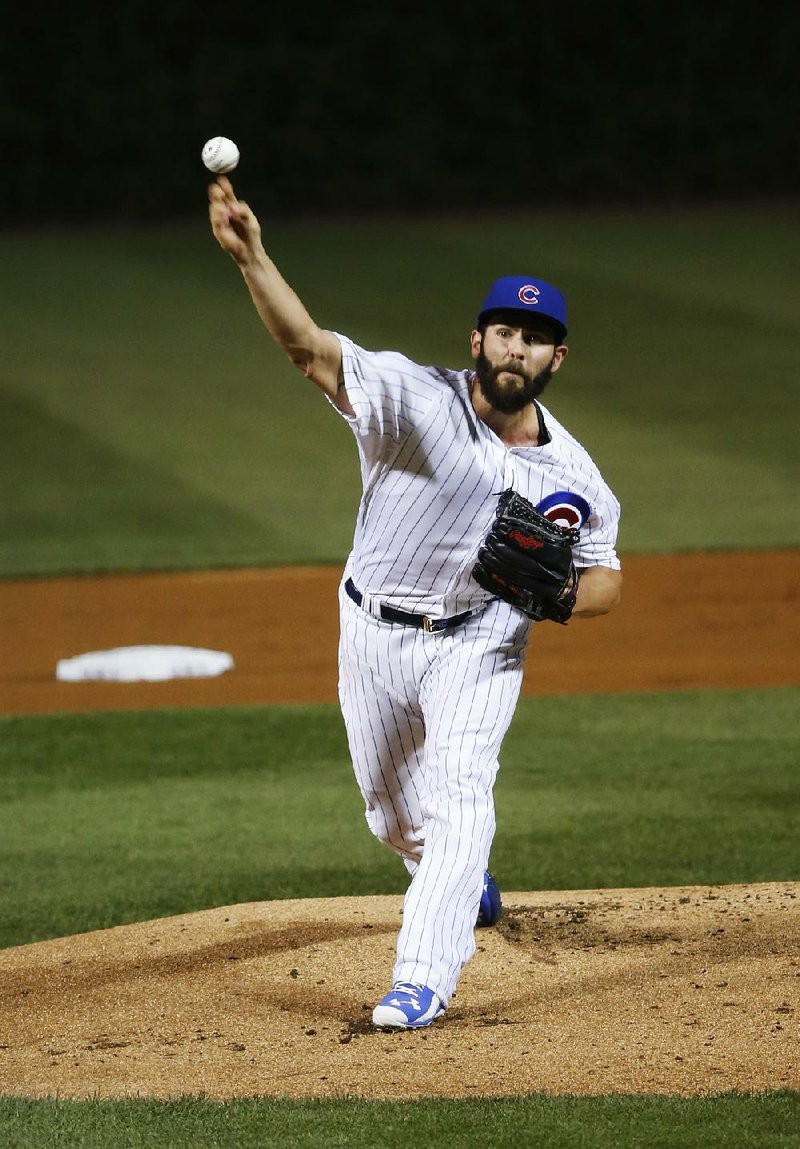Chicago right-hander Jake Arrieta became the season’s first 20-game winner with a complete-game performance in the Cubs’ 4-0 victory over Milwaukee Tuesday in Chicago.