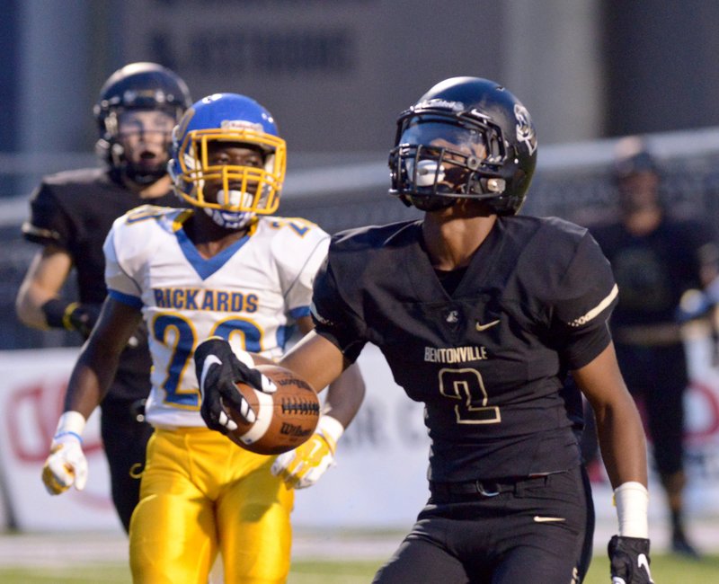 Kam’ron Mays-Hunt, Bentonville wide receiver, scores a touchdown on Friday during the first quarter against Tallahassee (Fla.) Rickards in Bentonville’s Tiger Stadium.