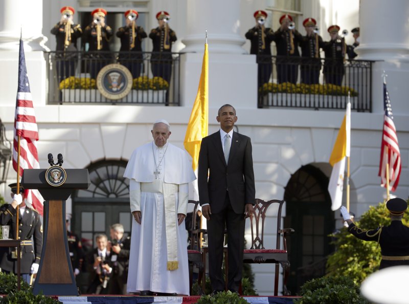 President Barack Obama and Pope Francis stand at attention during the playing of the national anthems during a state arrival ceremony for the pope, Wednesday, Sept. 23, 2015, on the South Lawn of the White House in Washington. (AP Photo/Pablo Martinez Monsivais)
