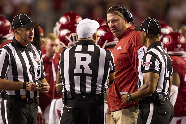 Arkansas coach Bret Bielema talks with officials during a game against Texas Tech on Saturday, Sept. 19, 2015, at Razorback Stadium in Fayetteville. 