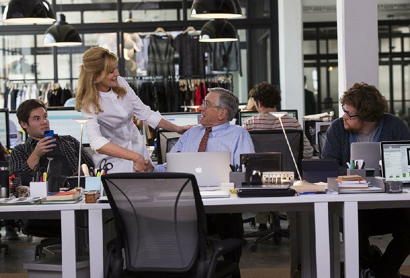 Fiona (Rene Russo) consults with the new guy, 70-year-old widower Ben (Robert De Niro), while co-workers Jason (Adam DeVine) and Davis (Zack Pearlman) look on in Nancy Meyers’ new workplace comedy, The Intern.