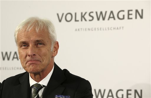 Newly appointed Volkswagen CEO Matthias Mueller smiles after a meeting of Volkswagen's supervisory board in Wolfsburg, Germany, on Friday, Sept. 25, 2015, after CEO Martin Winterkorn resigned Wednesday amid an emissions scandal.