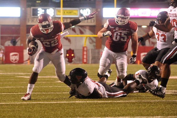 Arkansas running back Rawleigh Williams III tries to shake Texas Tech defenders as he runs the ball inside the 10-yard line in the third quarter Saturday, Sept. 19, 2015, at Razorback Stadium in Fayetteville.