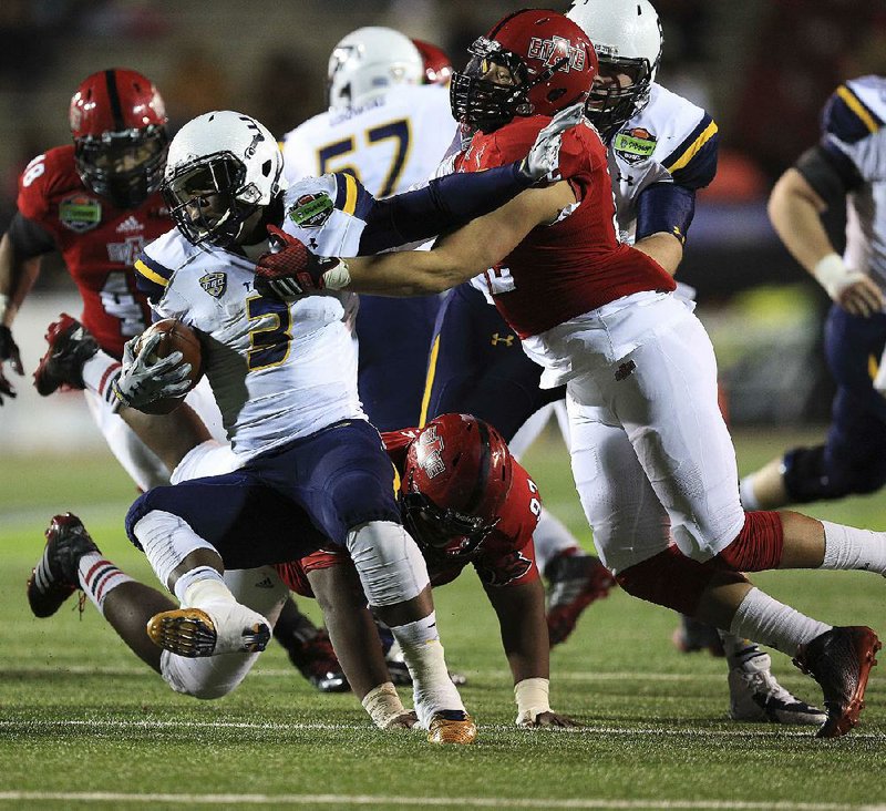 Arkansas State defensive end Chris Stone (right) and the rest of the defensive line will get another crack today at trying to shut down Toledo’s running game, which amassed 365 yards against the Red Wolves in a 63-44 victory in last season’s GoDaddy Bowl.