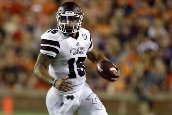 Mississippi State quarterback Dak Prescott scrambles for a first down during the second half of an NCAA college football game against Auburn, Saturday, Sept. 26, 2015, in Auburn, Ala. (AP Photo/Butch Dill)