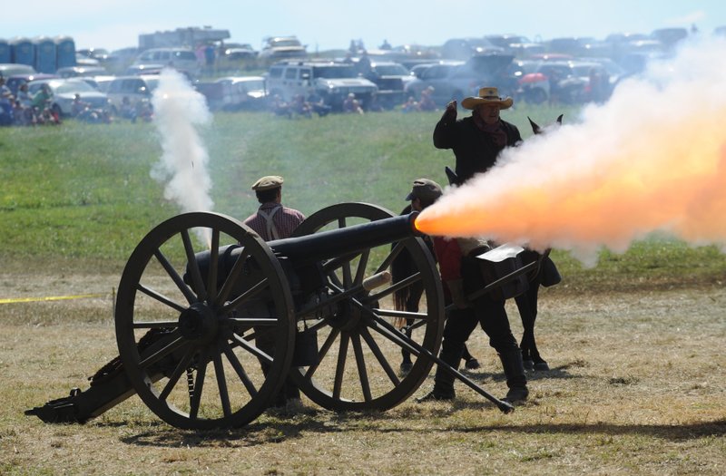 NWA Democrat-Gazette/ANDY SHUPE A cannon is fired Saturday during a re-enactment of the Civil War Battle of Pea Ridge in Pea Ridge. Visit nwadg.com/photos to see more photos from the weekend. Visit nwadg.com/photos to see more photos from the weekend.