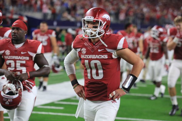 Arkansas quarterback Brandon Allen walks off the field after losing in overtime to Texas A&M at AT&T Stadium in Arlington, Texas, on Saturday, Sept. 26, 2015.
