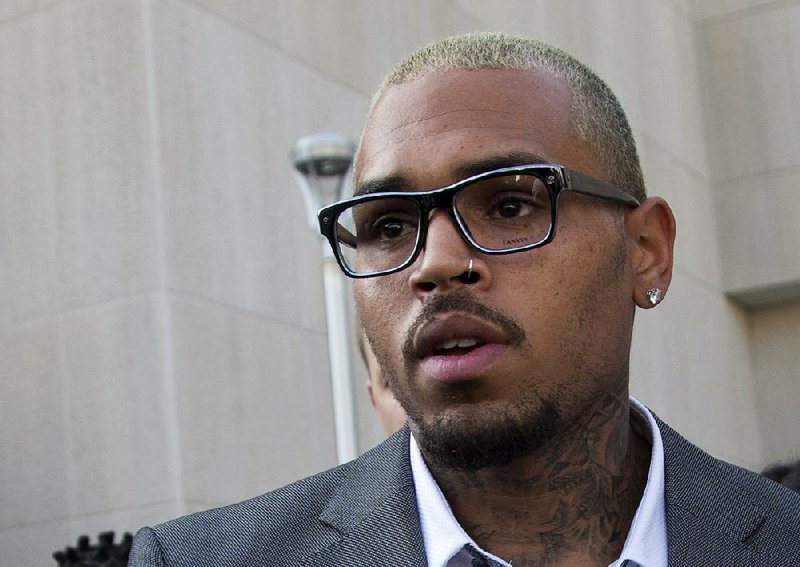 Singer Chris Brown leaves District of Columbia Superior Court in Washington, Tuesday, Sept. 2, 2014, after pleading guilty on a misdemeanor assault.