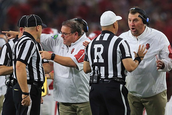 Arkansas coach Bret Bielema, right, and offensive line coach Sam Pittman argue with officials during a game against Texas A&M on Saturday, Sept. 26, 2015, at AT&T Stadium in Arlington, Texas. 