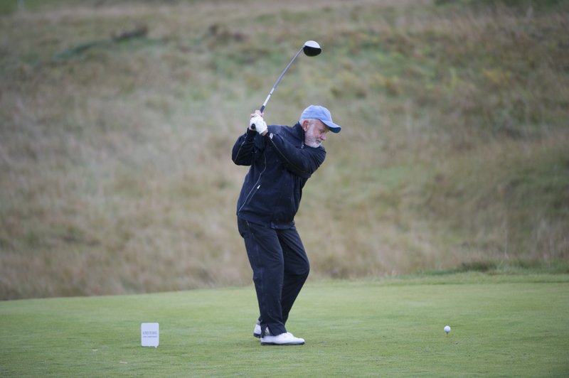 John Tyson, Tyson Foods chairman, hits a tee shot at the Kingsbarn links course during the 2014 Alfred Dunhill Links Championship. Tyson will team with former Arkansas golfer David Lingmerth for this year’s event, which starts Thursday in Scotland.

