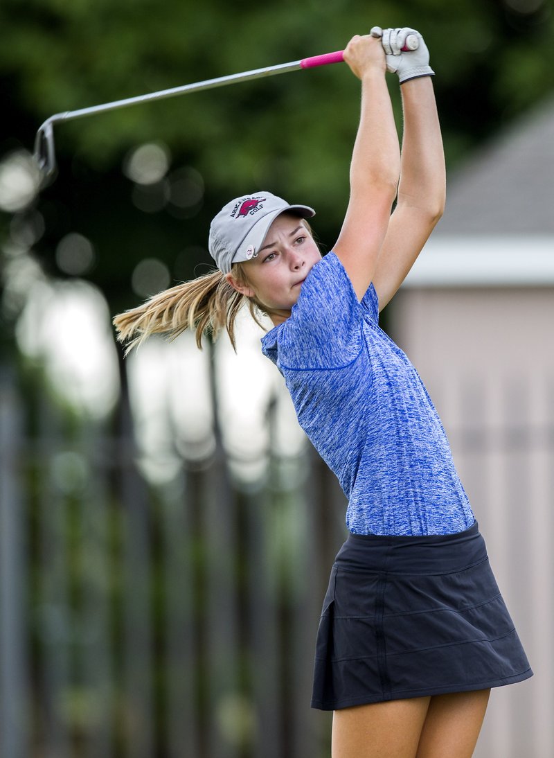 Rogers High junior Brooke Matthews hits from the second tee on Aug. 17 against Rogers Heritage at Lost Springs Golf Course in Rogers.
