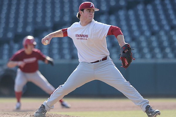 Arkansas pitcher Cannon Chadwick delivers a pitch during practice Friday, Jan. 23, 2015, at Baum Stadium in Fayetteville.
