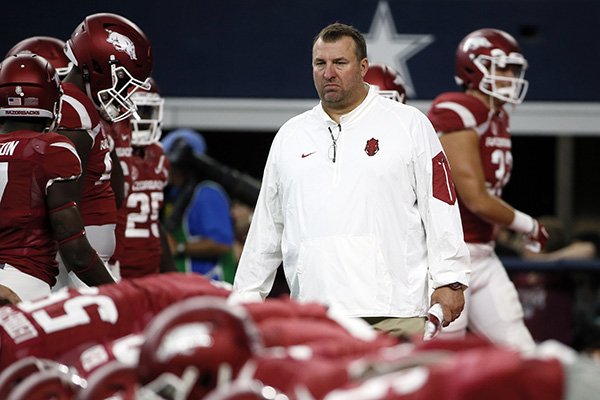 Arkansas coach Bret Bielema watches his team warm up before an NCAA college football game against Texas A&M on Saturday, Sept. 26, 2015, in Arlington, Texas. (AP Photo/Tony Gutierrez)