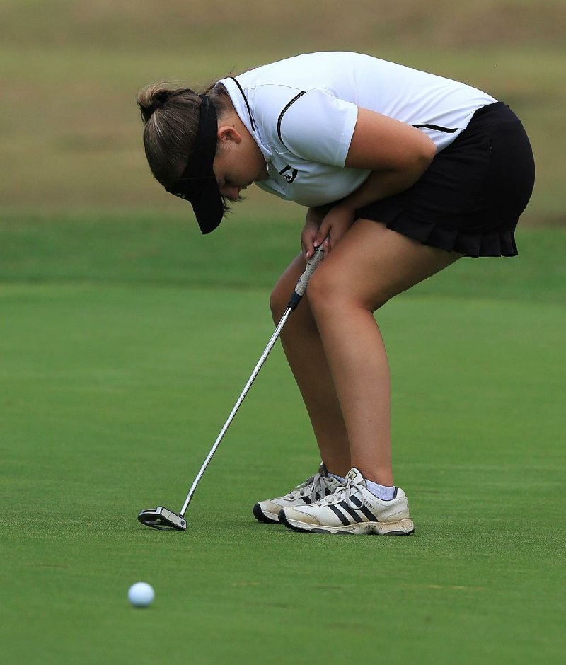 Little Rock Central’s Lauren Shepard reacts after missing a putt on the first hole during the first round of the Class 7A girls golf state tournament Tuesday at Conway Country Club. Shepard shot an 83 and is tied for eighth place entering today’s final round. 