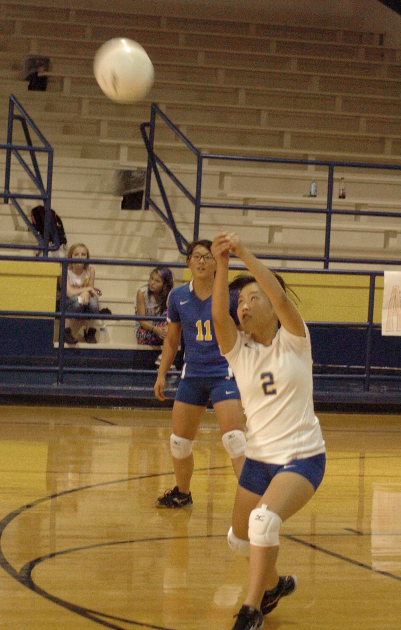 Photo by Mike Eckels Mailee Xiong (Decatur #2) returns the ball during the Decatur-Elkins match at Peterson Gym in Decatur Sept. 24. The Lady Bulldogs fell to the Lady Elks, 3 to 0, to suffer their third loss of the season.