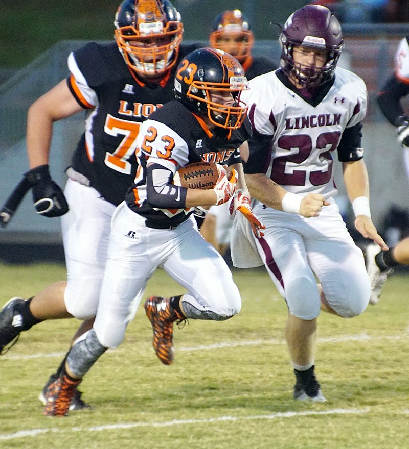 Photo by Randy Moll Brady Moorman (#23), Gravette sophomore, returns the kick, pursued by Lane Phelen (#23), Lincoln senior, during play between the two teams in Gravette&#8217;s Lion Stadium on Friday, Sept. 25, 2015.