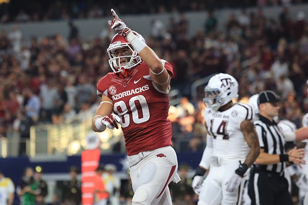 Arkansas receiver Drew Morgan celebrates after scoring a touchdown during the first quarter of a game against Texas A&M on Saturday, Sept. 26, 2015, at AT&T Stadium in Arlington, Texas. 