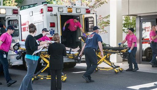 A patient is wheeled into the emergency room at Mercy Medical Center in Roseburg, Ore., after a deadly shooting at Umpqua Community College in Roseburg on Thursday, Oct. 1, 2015. 