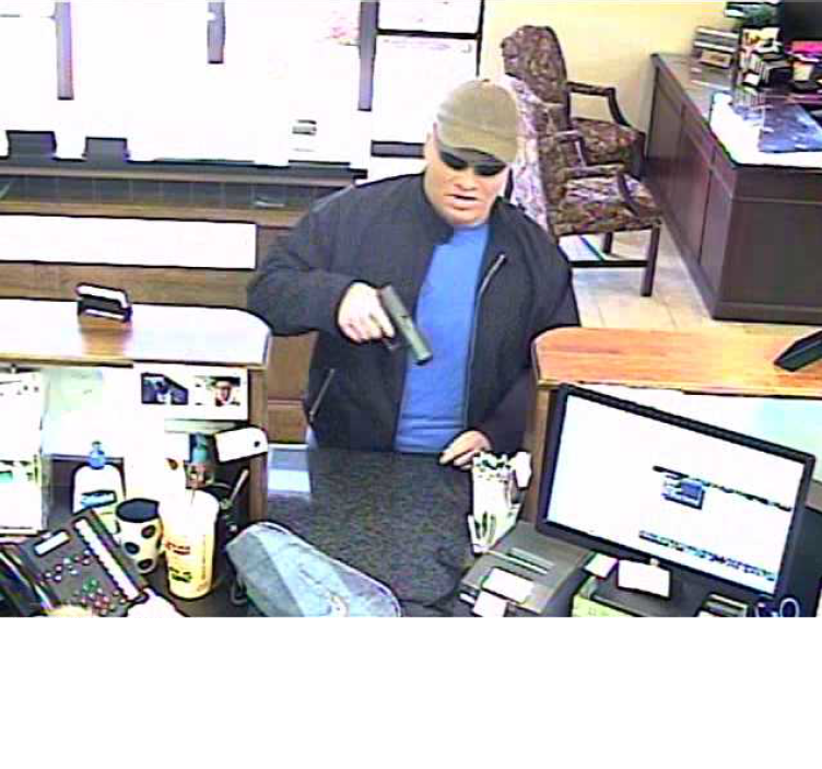The suspect in a bank robbery Thursday in Fayetteville. The suspect was wearing a rubber mask, police said.