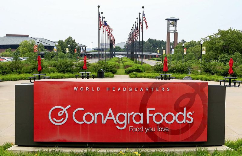 Flags fly over ConAgra Foods world headquarters in Omaha, Neb. The company announced Thursday it was moving its headquarters to Chicago.