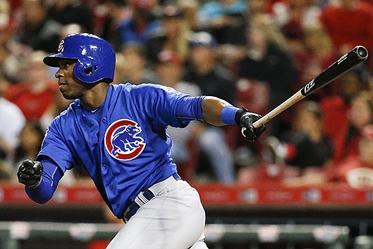 The Associated Press GAINING GROUND: Austin Jackson doubles home a run off Cincinnati starter Anthony DeSclafani in the fifth inning of the Chicago Cub' 5-3 road victory Thursday. With three games left in the regular season for both teams, the Cubs trail the Pittsburgh Pirates by two games in the race to host the National League wild-card playoff game.