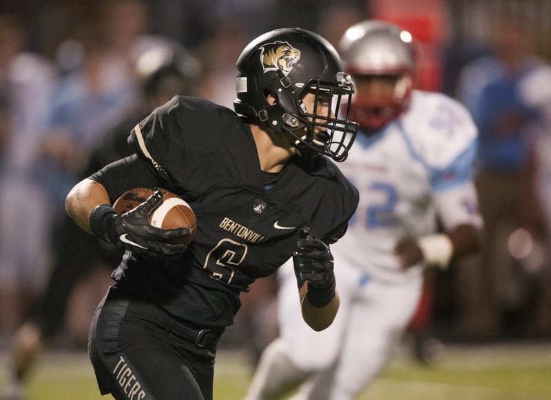 Clay Barganier, Bentonville wide receiver, runs the ball Sept. 25 in the second quarter during the game against Fort Smith Southside in Bentonville’s Tiger. 
