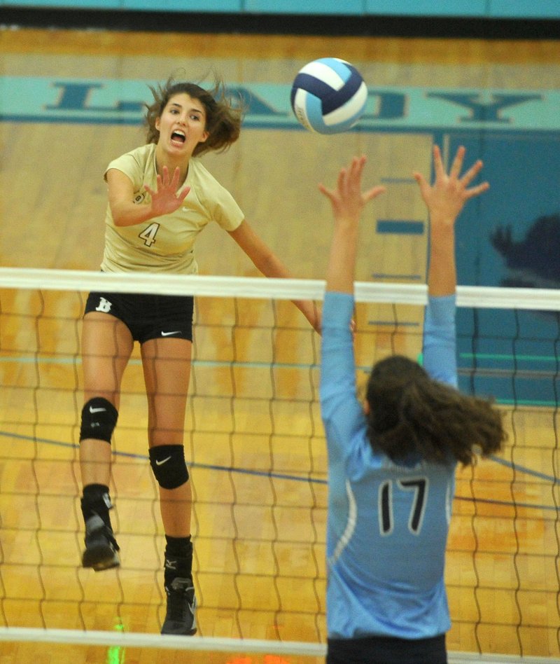 Sadie Pate of Bentonville tries to knock the ball past Har-Ber’s Jaden Williams during Thursday’s game at Har-Ber High School.