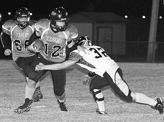 The Sentinel-Record/Lorien E. Dahl CLOSING IN: Cutter Morning Star’s Emilio Arteaga (12) tries to break the tackle of Quitman’s Eli Peck in Friday night’s 2A-5 game at Eagle Field. CMS plays at Poyen next week before an Oct. 16 home conference game against England.