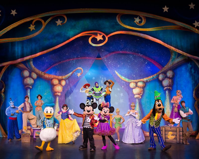 The cast of Disney Live! Mickey and Minnie's Doorway to Magic appears on stage. Cast members include characters from "Aladdin," "Tangled" and "Toy Story," as well as Disney classic characters such as Mickey Mouse, Minnie Mouse, Donald Duck, Goofy, Snow White and Tinker Bell.