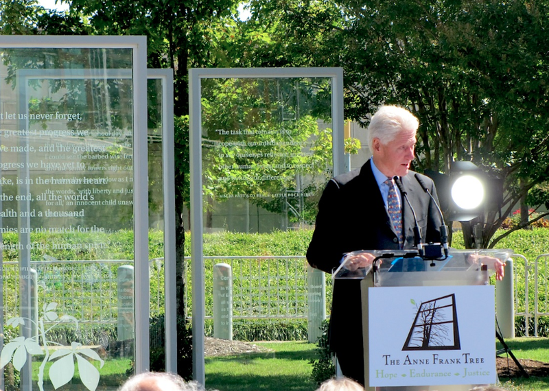 President Bill Clinton speaks Friday, Oct. 2, 2015, on a new human-rights exhibit at the Clinton Center that largely commemorates the legacy of Anne Frank. The outdoor exhibit features five panels that detail moments in human-rights history abroad and in Arkansas.