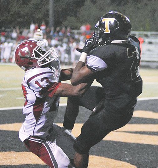 The Sentinel-Record/Mara Kuhn Hot Springs’ Cleo Floyd (2) snags a touchdown pass away from Hope’s Deandrea Scott late in the first half Friday night at Reese Memorial Stadium. The 5A-South game matched two of the state’s top recruits, Floyd and Arkansas commit McTelvin Agim of Hope. The Trojans stay home next week against De Queen. See related story on 2B.