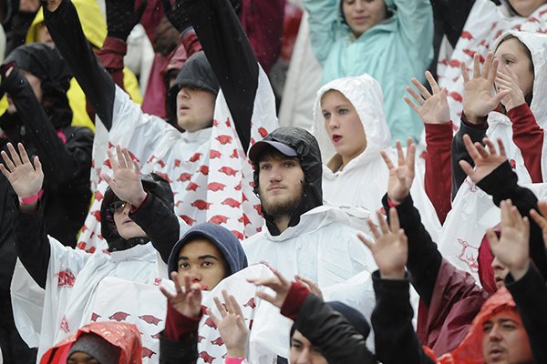 Fans wear ponchos during a game between Arkansas and Ole Miss on Saturday, Nov. 22, 2014, at Razorback Stadium in Fayetteville. 