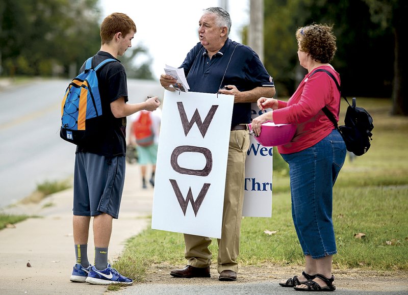 The Rev. Dale Jirousek (center), pastor of Peace Lutheran Church in Rogers, and his wife, Jan Jirousek, talk Wednesday to Rogers Heritage High School freshman Brett Lemmond about the church’s “Way Out Wednesdays,” an after-school program for teens. 