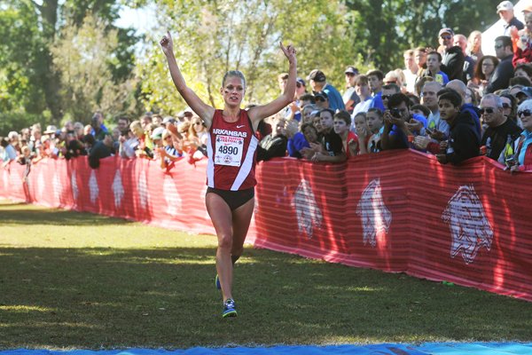 Arkansas cross country runner Dominique Scott crosses the finish line to take first in the College Women's 5000m at the 2015 Chile Pepper Cross Country Festival Saturday, Oct. 3, 2015, in Fayetteville.