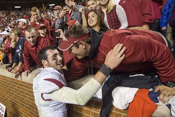 Arkansas quarterback Brandon Allen celebrates with fans following a game against Tennessee on Saturday, Oct. 3, 2015, at Neyland Stadium in Knoxville, Tenn. 