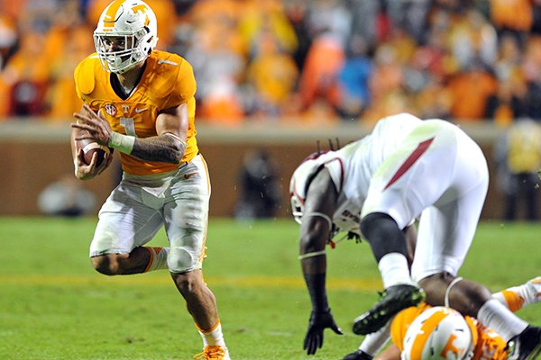 Tennessee running back Jalen Hurd (1) runs the ball as teammate and tight end Ethan Wolf (82) blocks Arkansas linebacker Josh Williams (21) during the first half of an NCAA college football game at Neyland Stadium in Knoxville, Tenn. on Saturday, Oct. 3, 2015. (Michael Patrick/Knoxville News Sentinel via AP)