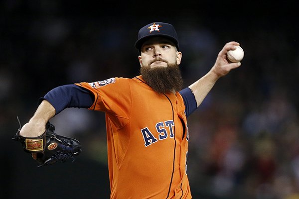 Houston Astros' Dallas Keuchel throws a pitch against the Arizona Diamondbacks during the first inning of a baseball game Friday, Oct. 2, 2015, in Phoenix. (AP Photo/Ross D. Franklin)