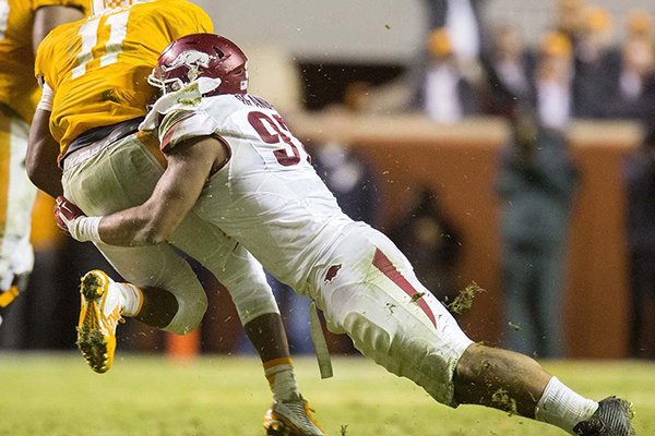 Arkansas defensive end Tevin Beanum sacks Tennessee quarterback Josh Dobbs during the fourth quarter of a game Saturday, Oct. 3, 2015, at Neyland Stadium in Knoxville, Tenn. 