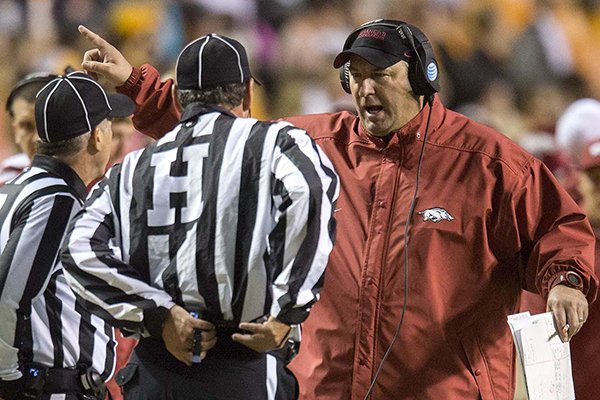 Arkansas coach Bret Bielema talks to officials during a game against Tennessee on Saturday, Oct. 3, 2015, at Neyland Stadium in Knoxville, Tenn. 