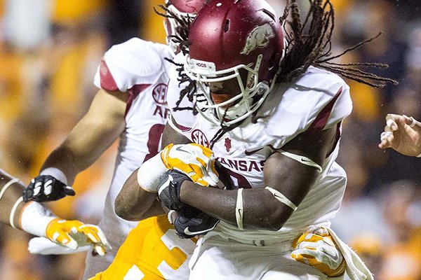 Arkansas running back Alex Collins runs during the first quarter of a game against Tennessee on Saturday, Oct. 3, 2015, at Neyland Stadium in Knoxville, Tenn. 