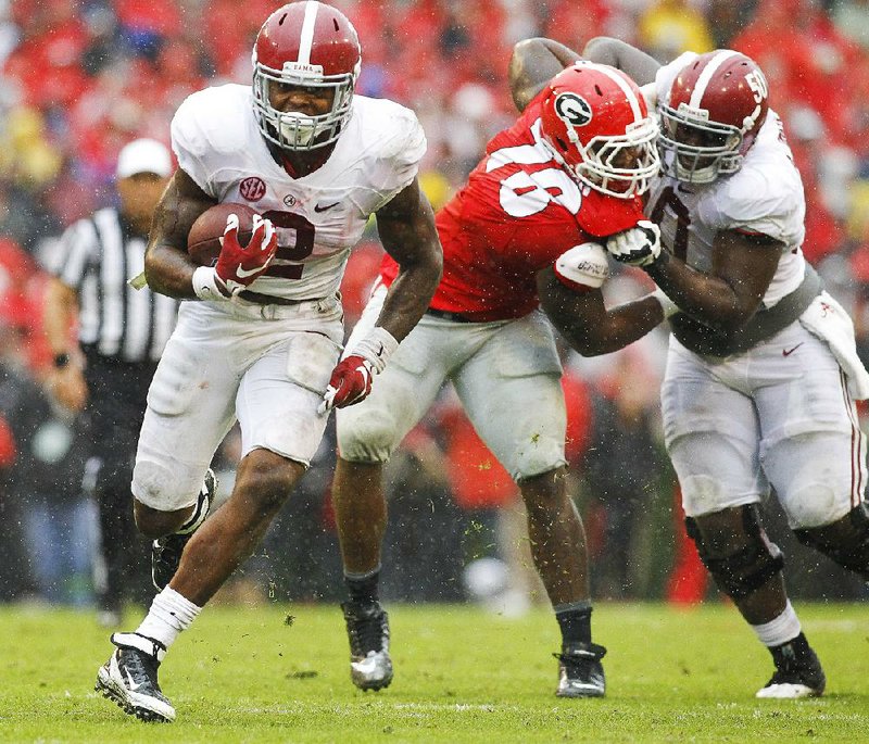 Alabama running back Derrick Henry (2) ran for more than 100 yards for third time this season, and the Crimson Tide finished with nearly 400 yards of total offense in knocking off No. 8 Georgia 38-10 on Saturday.
