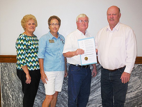 Submitted photo PROCLAMATION SIGNING: Carolyn Davis, left, Garland County Master Gardeners publicity chairperson, Linda Doherty, president, and Allen Bates, Garland County extension agent, attended the proclamation signing by Judge Rick Davis who proclaimed Oct. 11-17 as Arkansas Master Gardener Week.