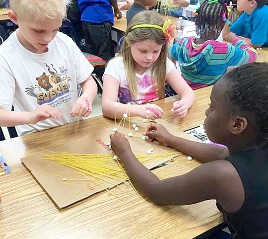 Submitted photo Gardner STEM Magnet School students, from left, Dallas Yelvington, Jamie Keene and Saniyha Coleman work together to construct a tower out of spaghetti sticks and mini-marshmallows in Lauren Sierocuk's third-grade class.