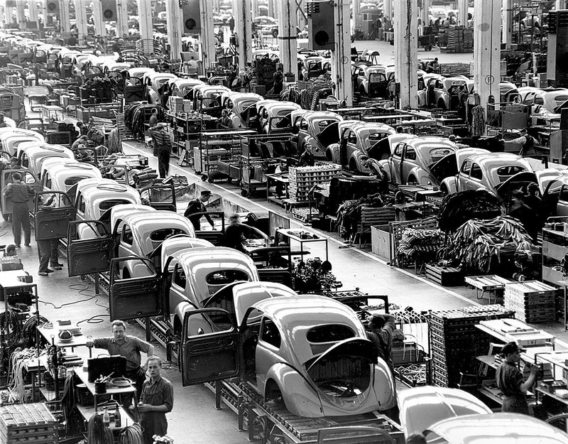 In this June 16, 1954, fi le photo, VW Beetles are assembled at the Volkswagen plant, which manufactured nearly 900 automobiles each day in Wolfsburg, Germany.